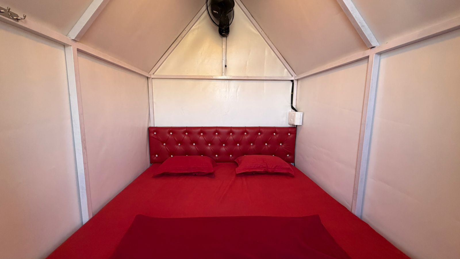 Inside the triangular tent seen from the front