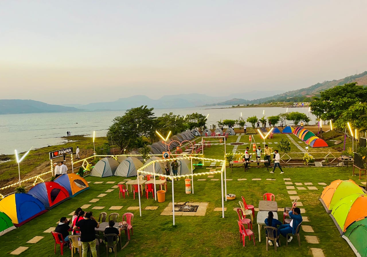 Side aerial view of the Pawna Machi campsite and lake