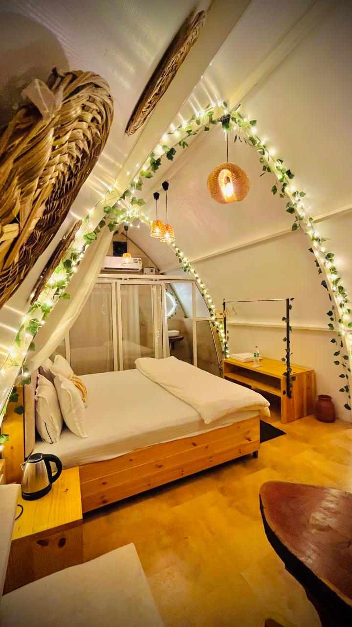 Arched cottage bedroom with fairy lights
